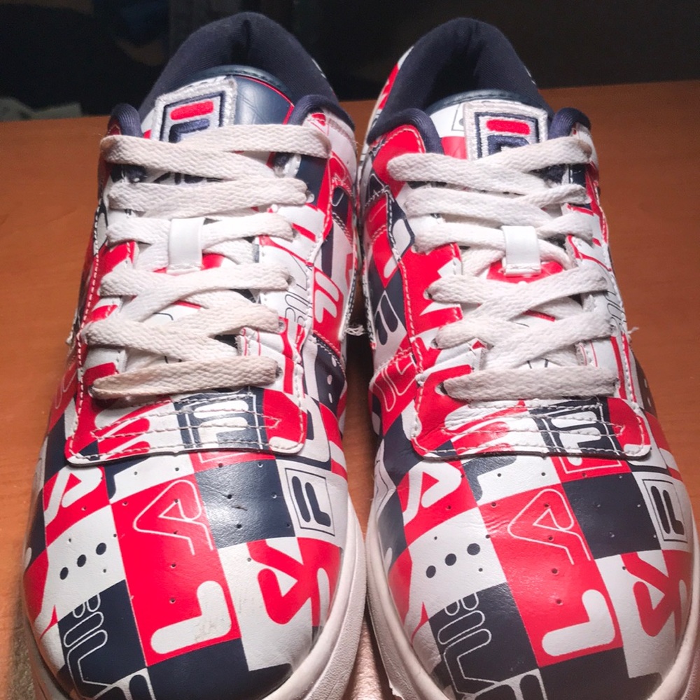 Men’s size 11.5 low top Fila collage sneakers.